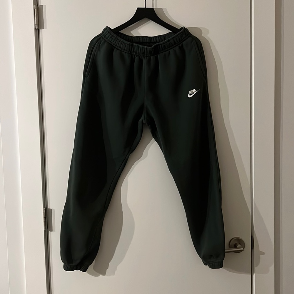 Nike jogger sweatpants with two front pockets and one buttoned back pocket